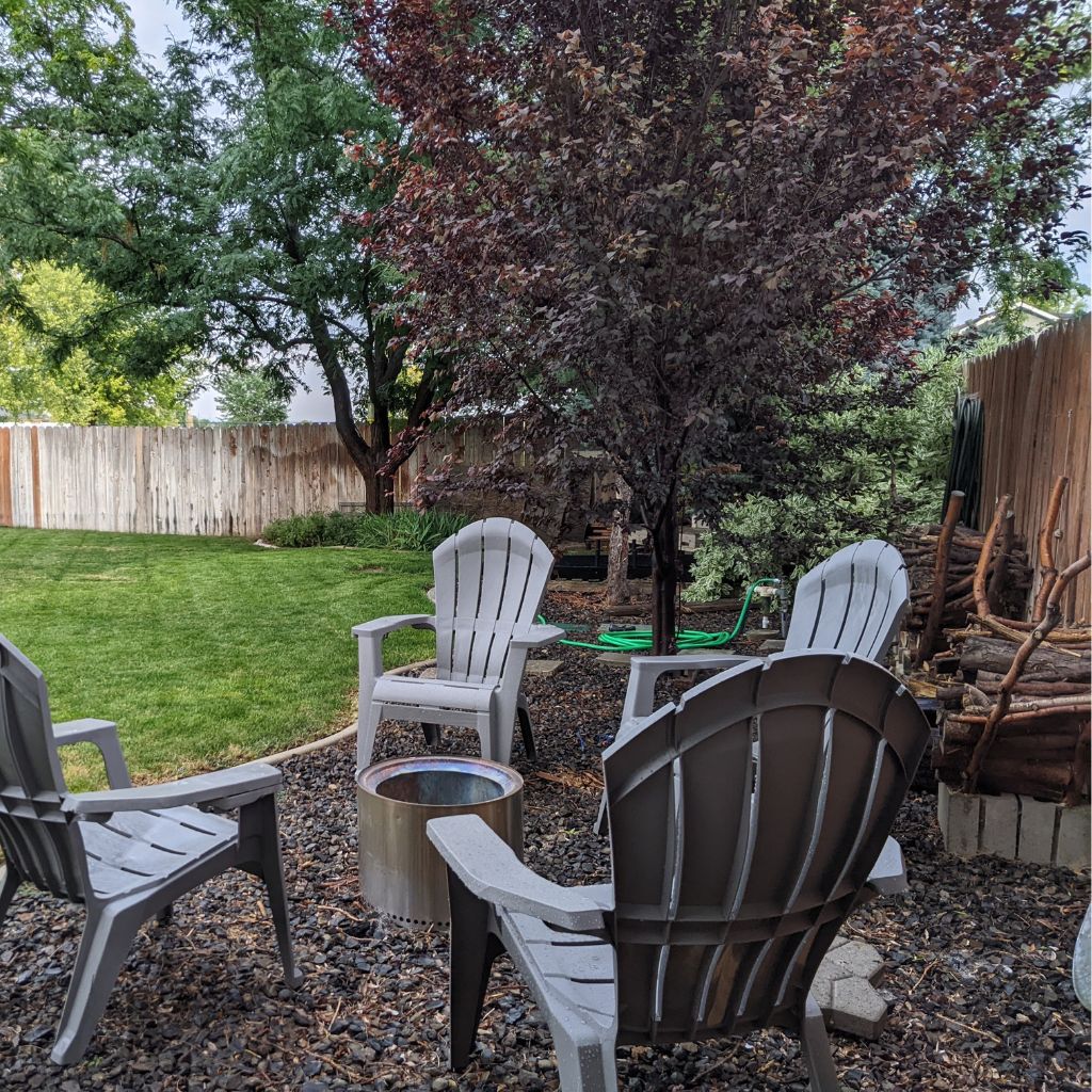 Backyard with Fire Pit of Restful Meadows Vacation Rental